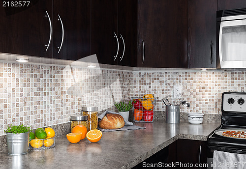 Image of Contemporary kitchen with food ingredients on countertop