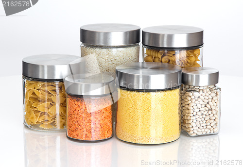 Image of Food ingredients in glass jars, on white background