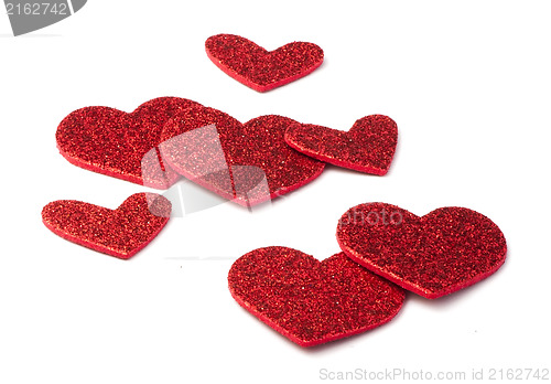 Image of Red shiny hearts on white background