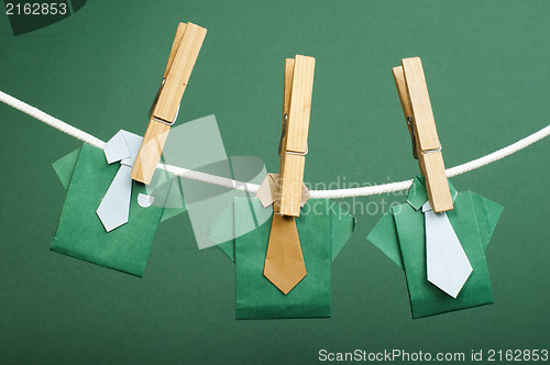 Image of Origami shirts on rope