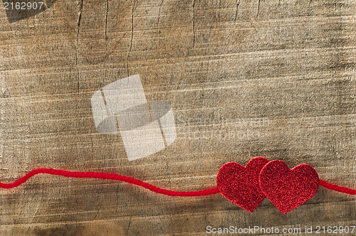 Image of Red ribbon tape and two hearts