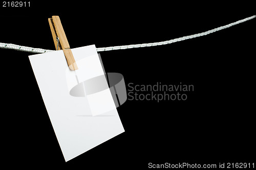 Image of Note paper hooked on a rope