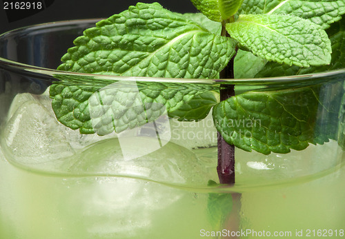 Image of Green cocktail with cubes ice