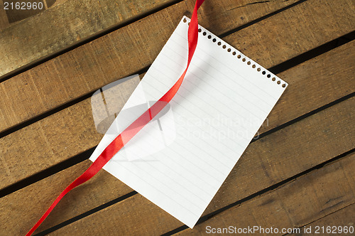 Image of Ribbon and white paper sheet