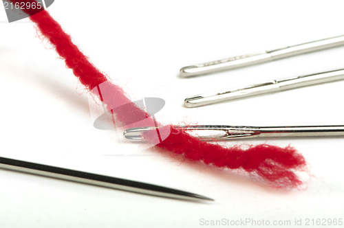 Image of Sewing needles and red thread