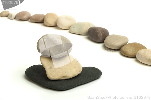 Image of Stacked stones white isolated