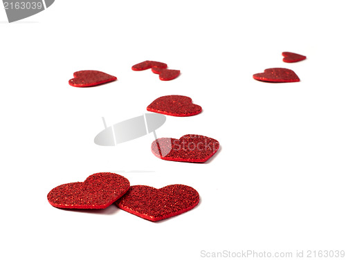 Image of Red shiny hearts on white background