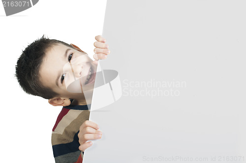 Image of Little boy holding a whiteboard