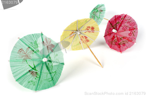 Image of Colorful cocktail umbrellas white isolated