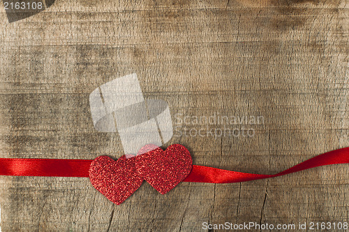 Image of Red ribbon tape and two hearts