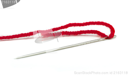 Image of Sewing needle and red thread