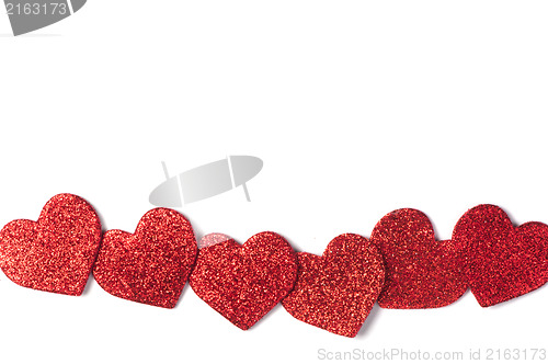 Image of Red shiny hearts on white background