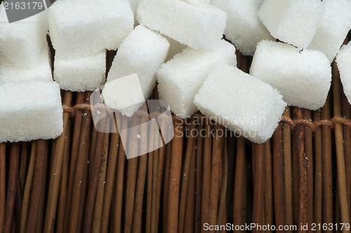 Image of Sugar lumps on wooden base