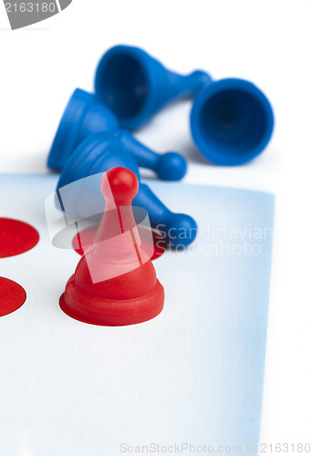 Image of Red and blue game pawns white isolated