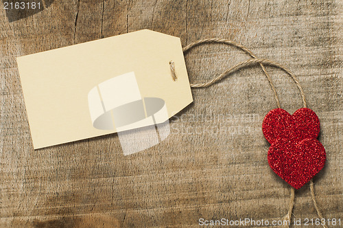 Image of Paper label with rope and red hearts
