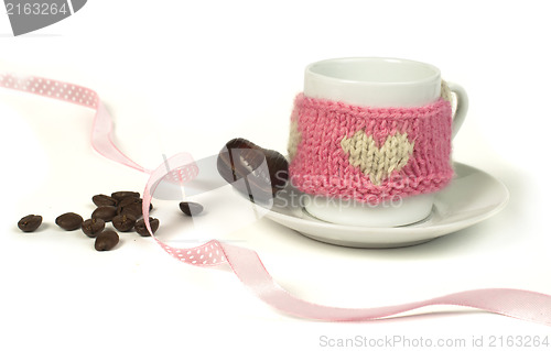 Image of Cup of coffee with knitted heart symbol