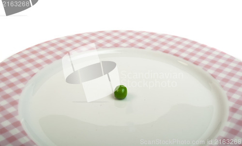 Image of Plate with peas white isolated