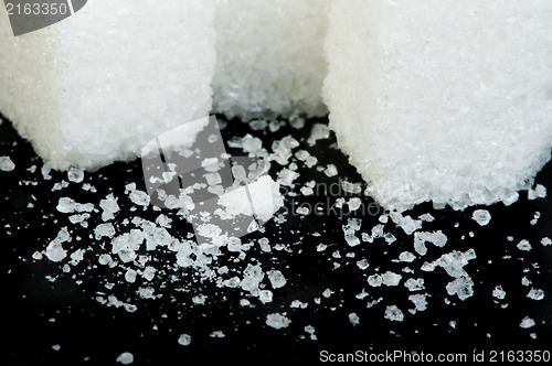 Image of Sugar lumps black isolated