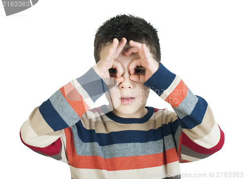 Image of Child looking through his ??hands