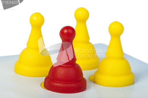 Image of Red and yellow game pawns white isolated
