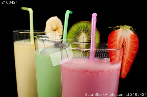 Image of Banana, kiwi and strawberry milk shake and fresh fruis