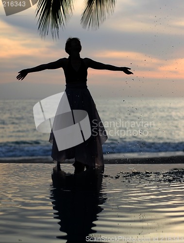 Image of Woman watching sunset