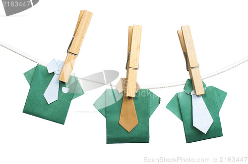 Image of Origami shirts on rope