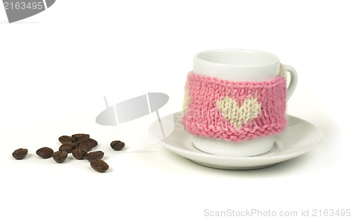 Image of Cup of coffee with knitted heart symbol