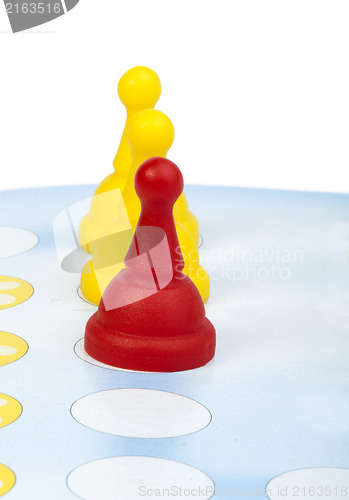 Image of Red and yellow game pawns white isolated