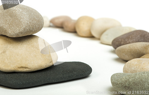 Image of Stacked stones white isolated