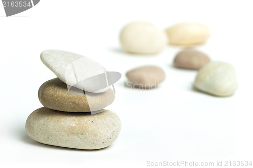 Image of Stacked stones white isolated