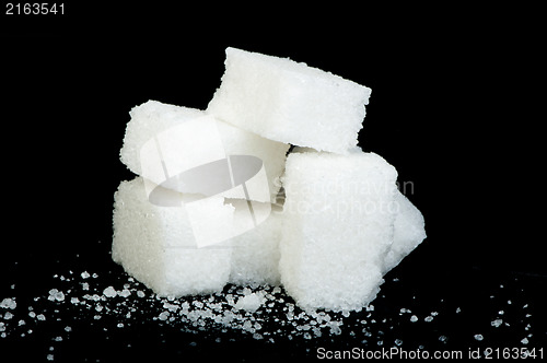 Image of Sugar lumps black isolated