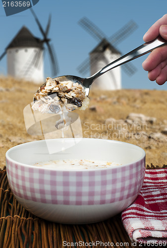 Image of Muesli breakfast in a bowl and mills