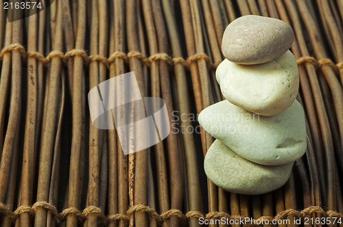 Image of Stacked stones on wooden base