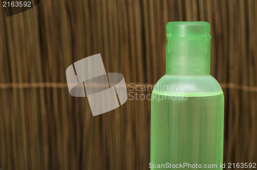 Image of Green transparent cosmetic bottle