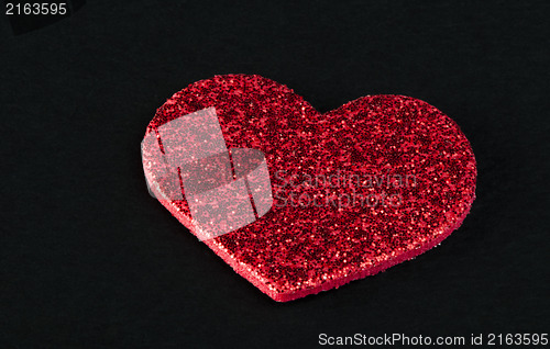 Image of Red shiny hearts on black background