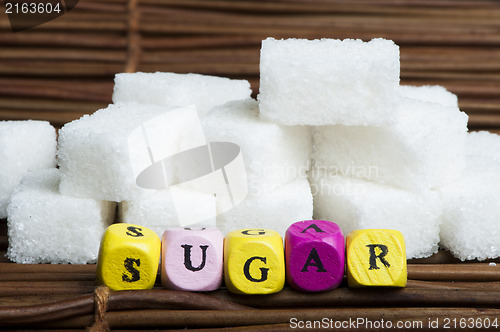 Image of Sugar lumps and text