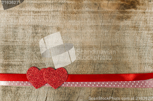 Image of Red ribbon tape and two hearts