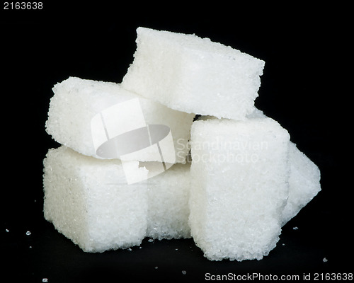 Image of Sugar lumps black isolated