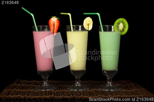 Image of Banana, kiwi and strawberry milk shake and fresh fruis