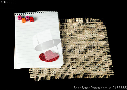 Image of Red hearts and white paper sheet 
