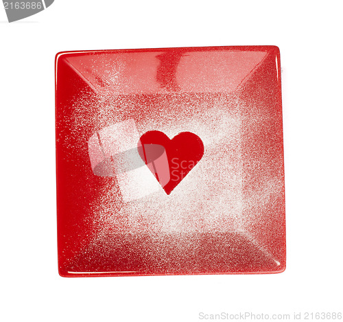 Image of Heart pattern on the bottom of a red bowl