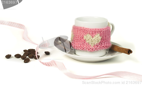 Image of Cup of coffee with knitted heart symbol