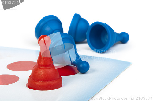 Image of Red and blue game pawns white isolated