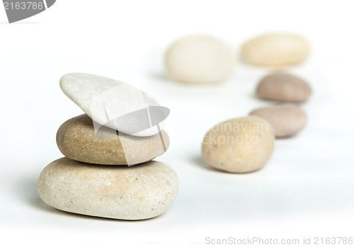 Image of Stacked stones white isolated