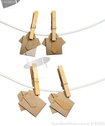 Image of Origami shirts on rope