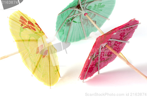 Image of Colorful cocktail umbrellas white isolated