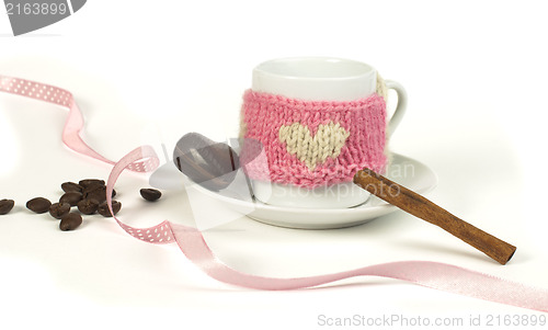 Image of Cup of coffee with knitted heart symbol