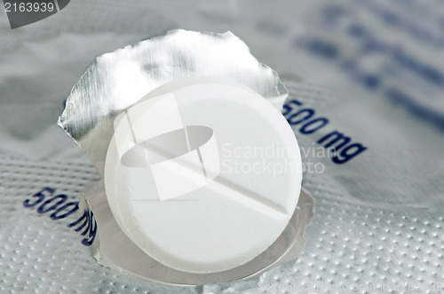 Image of White pill in a pack very close up