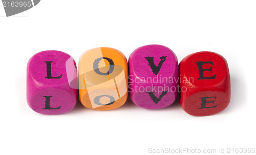 Image of Word love on multicolored wooden cubes